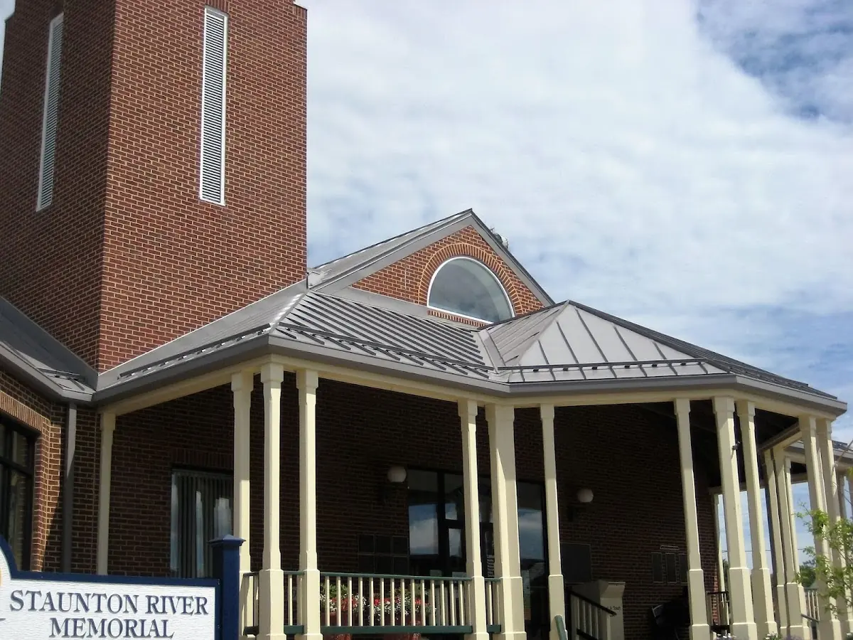 Skilled roofing craftsmen working on a residential roof in Indian Hills
